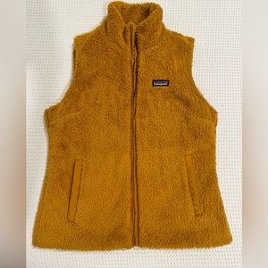 Large Patagonia vest orange brown color excellent condition, used.